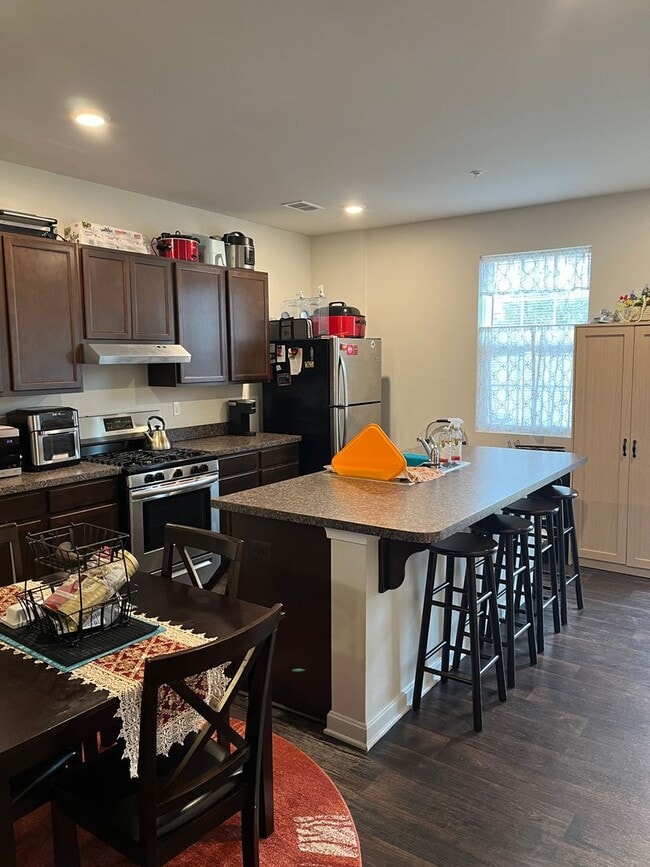 Photo - Modern 3BR/2.5BA Townhome in Trimble Meadows | LVP Floors | Stainless Kitchen + Island | Upstairs...