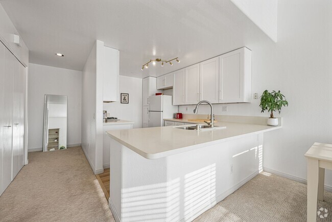 Building Photo - Thoughtfully Remodeled Condo W/ Attached G... Unit 35