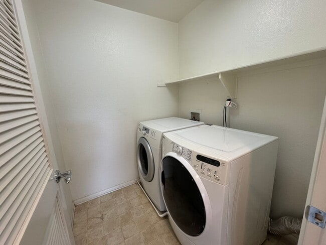 Photo - Sleek 2-Bed with a Den/Office + Flex Corner Condo with Attached Tandem Garage