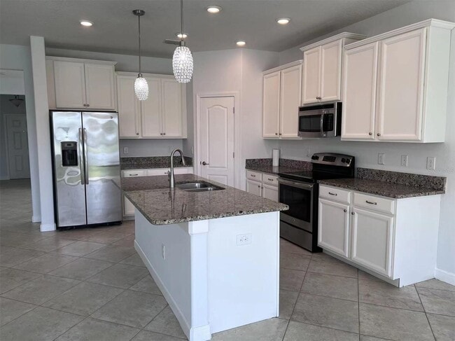 Photo - "Spacious 5-Bed Retreat with Elegant Hardwood & Granite Finishes in Tampa – 3 Full Baths & 3264 S...