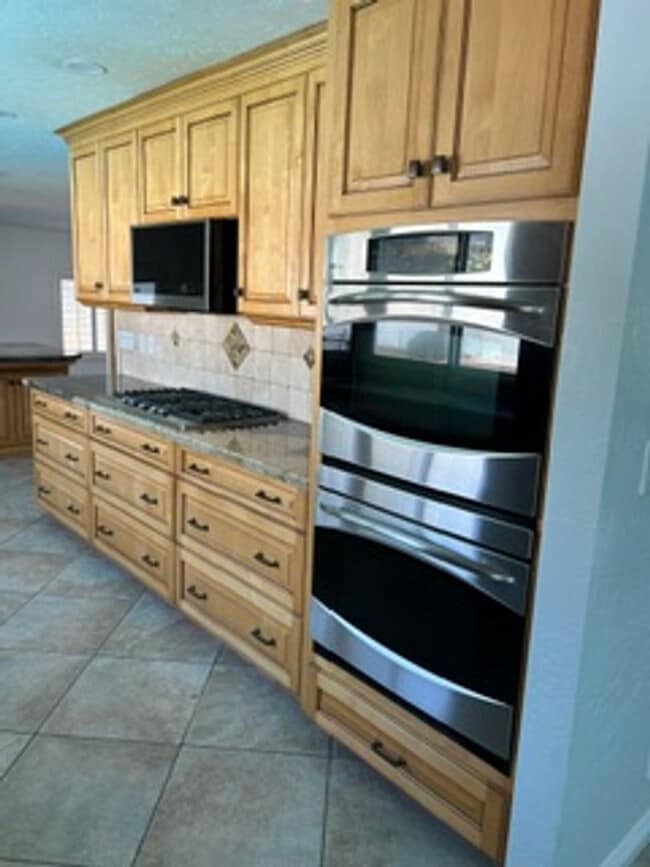 Photo - Spacious 4BR Home with Gated Pool, Chef’s Kitchen & 3-Car Garage