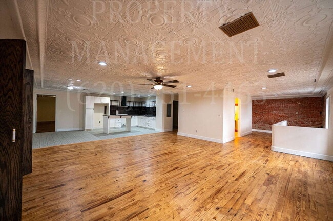 Building Photo - Beautifully Restored Downtown Caney, KS Apartment Unit 1