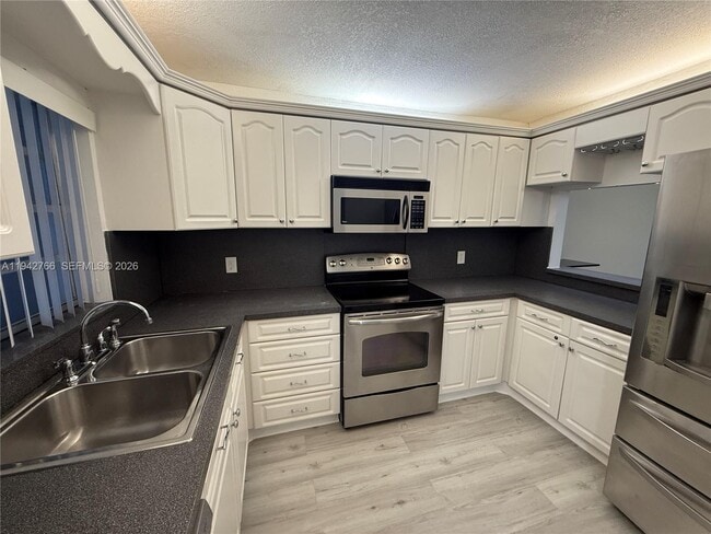 Photo - 9470 Live Oak Pl Unit 104