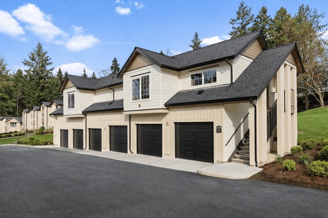 Modern Carriage-style Studio Apartment Building with Private Garages.