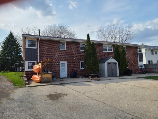 Back of side-by-side duplex. Patio and parking for 2 cars.