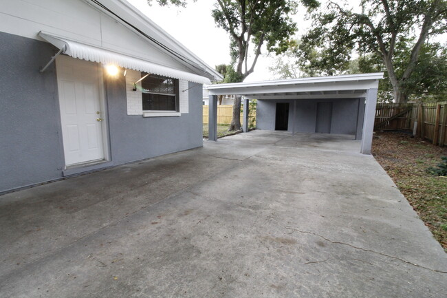 Exterior door, driveway, and carport - 1703 Bonnie Gail Dr Casa Adosada