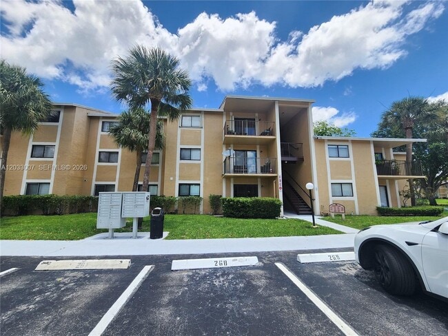 Building Photo - 9491 Palm Cir S Unit 205