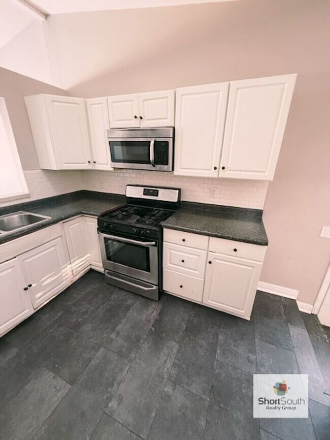 Photo - Lansing 4 bed 2 bath single family home with fenced in back yard.