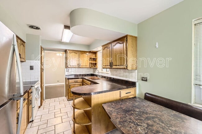 Building Photo - 8410 W 3rd Pl Rental