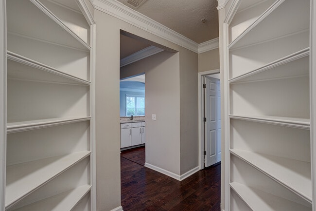 Entrance foyer with two floor-to-ceiling bookshelves - 1850 Cotillion Dr Unit 1009