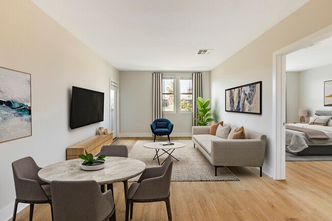Renovated Package III dining and living room with hard surface flooring