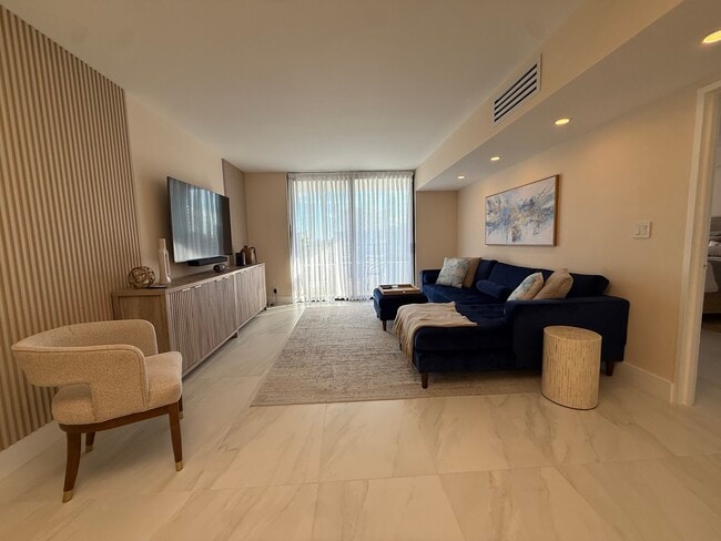 Living room with Smart TV - 500 Three Islands Blvd Unit 214A