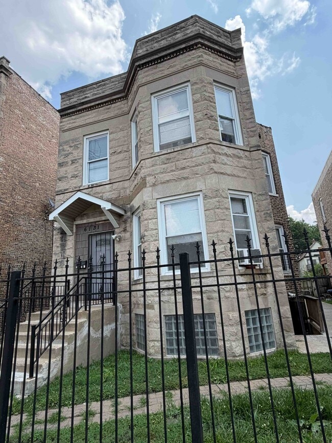 Building Photo - 6131 S Racine Ave Unit G