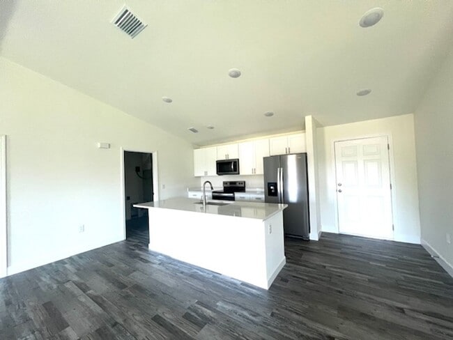 Building Photo - Available Now!! NW CAPE CORAL - 4 Bedrooms - 3 Bathrooms - 2 Car Garage