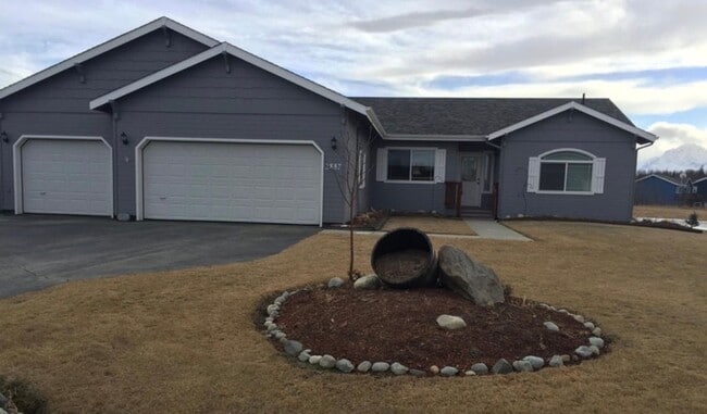 Photo - Ranch style 3 bedrooms with an office Plus a 3 car garage and large back yard complete with green...