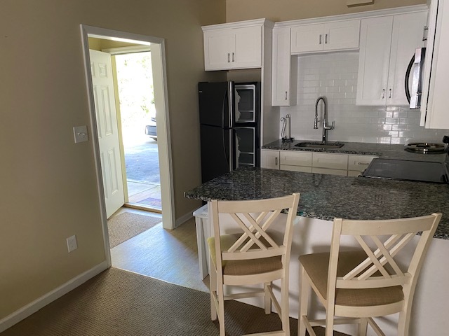Kitchen looking out front door - 137 Edgecombe Rd Apartments Unit Furnished and Utilities