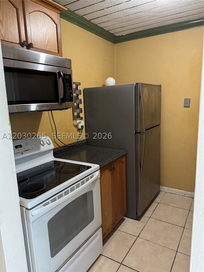 Building Photo - 7105 W 13th Ave Unit 403