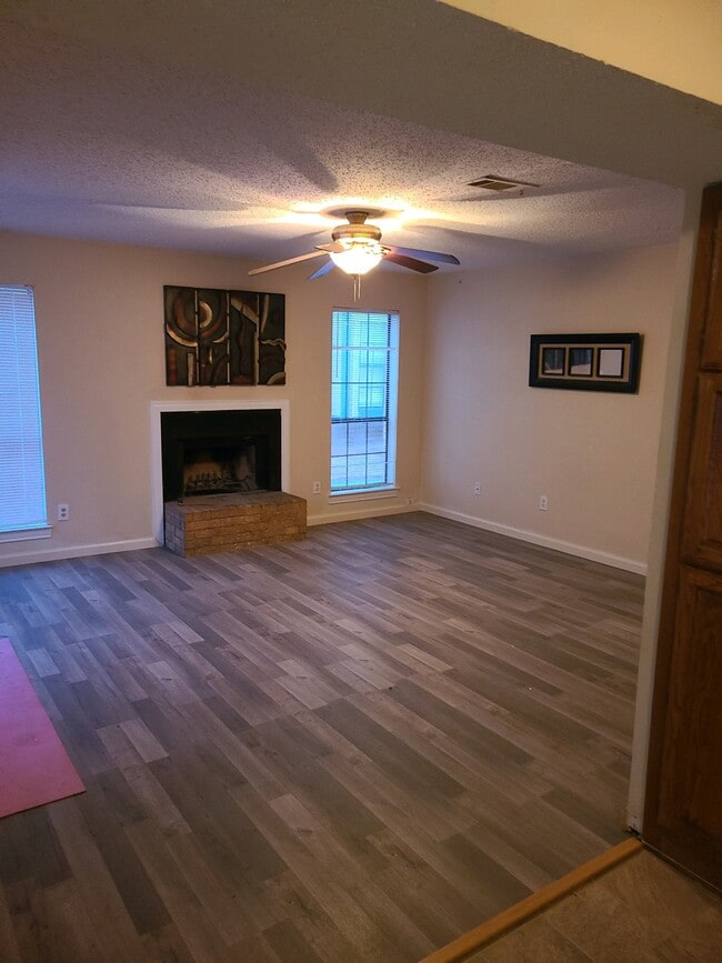 Photos are of identical layout - new flooring currently being installed - 201 W Trinity St Unit B