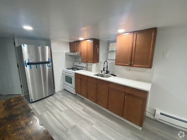 Building Photo - 1108 Paterson Plank Rd Unit Basement Rental