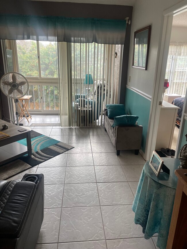 Living Room and Screened in Porch - 6424 Spring Flower Dr Unit 25