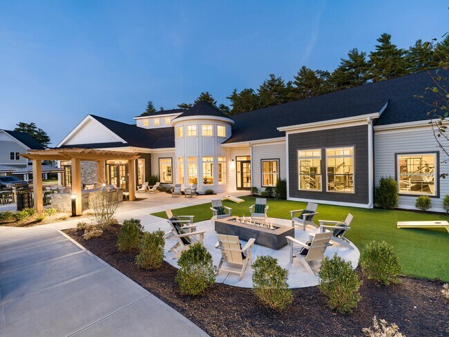 Evenings glow a little brighter with fireside seating, outdoor games, and inviting spaces at Modera South Shore. - Modera South Shore