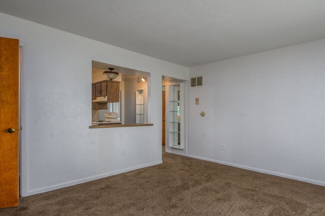 Living room, looking towards the kitchen - Cedar Ridge Apartments