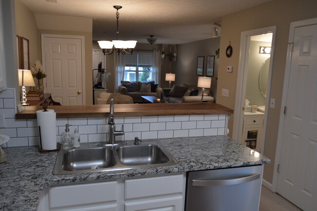 Open kitchen & living room - 425 Shadow Glen Dr Townhome