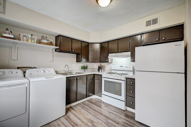 Recently Renovated Townhouse Style Apartments featuring New gray carpet, Neutral paint scheme, Premium hardwood-style flooring, Neutral paint scheme, Upgraded light fixtures, New cabinets, Matching stainless steel appliances, Washer/Dryer, Air conditioning, Heating, New bathroom vanity, Marble tub s