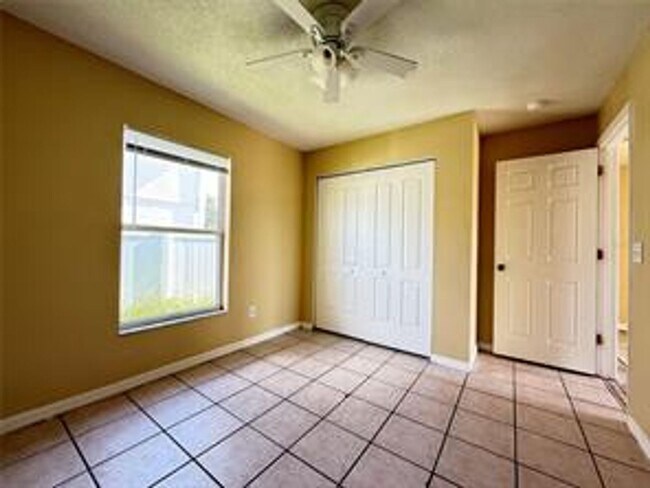 Photo - Charming 3-bed, 2-bath POOL home with 2-car garage. Features ceramic tile flooring, updated kitch...