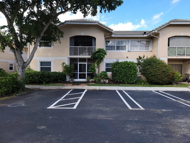 Building Photo - 12255 Royal Palm Blvd Unit 8-O