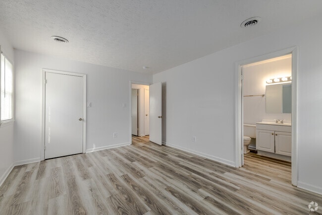 2BR, 1.5BA - 1,100SF - Primary Bedroom - Highlander Apartments