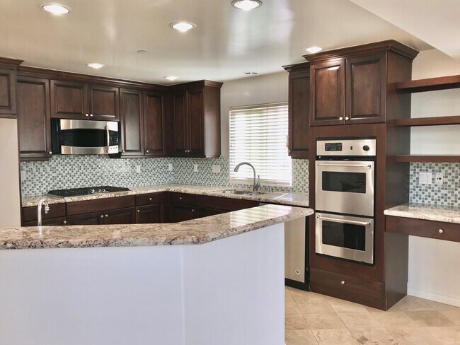 Kitchen and breakfast counter - 206 S Lucia Ave