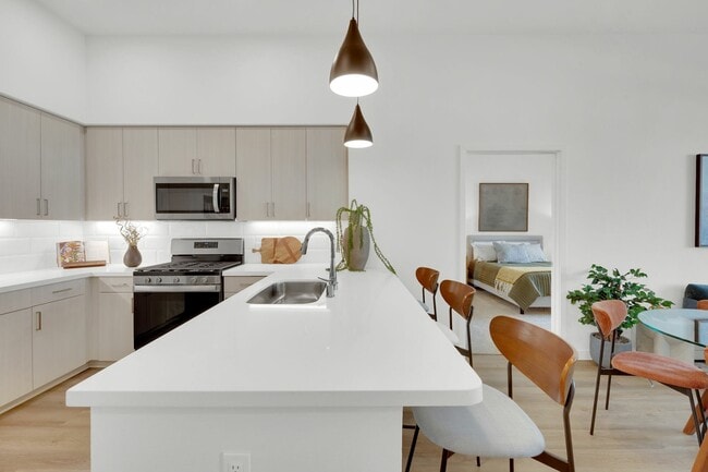 Bright kitchen with Euro-style cabinets at Enclave Heritage Flats in Otay Ranch