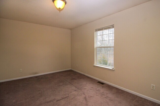 Photo - Spacious 4BR/2BA Duplex with 1 Car Garage & Washer/Dryer Included!
