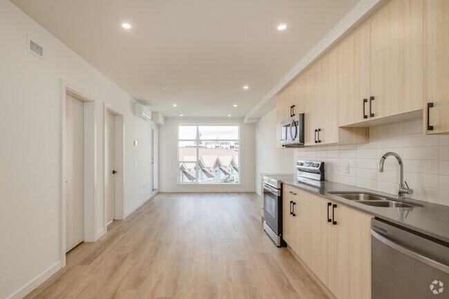 1BR, 1BA w/Den- 685SF - Living Room, Dining Room and Kitchen - The Kentwood