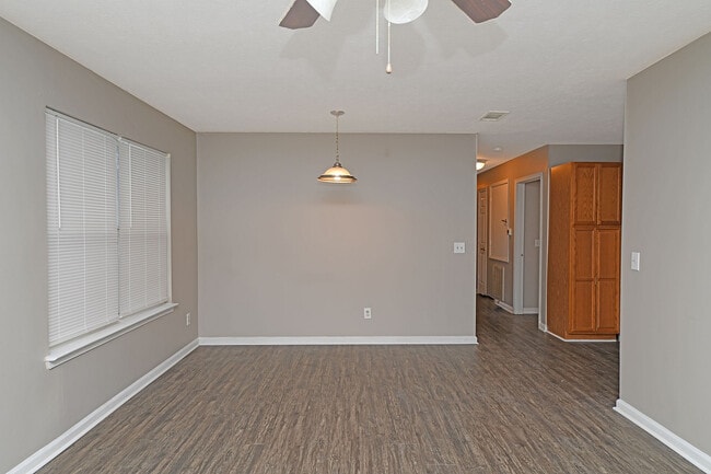 Spacious living room with hardwood-style flooring