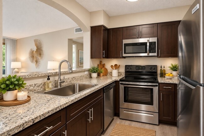 Elevate your cooking experience in Mosaic's modern kitchen, featuring sleek stainless steel appliances and elegant granite countertops. Perfectly designed for convenience and style. Schedule your visit today and see it for yourself!