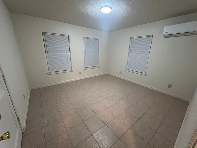 One bedroom with storage closet (left). 11’x11’. Mini split. - 217 N 1st St Unit 7