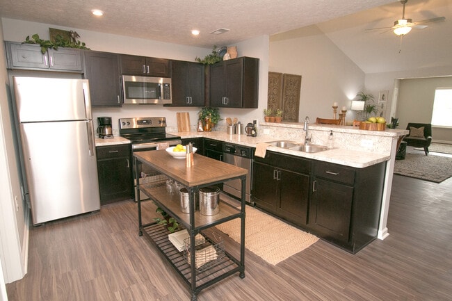luxury vinyl wood-plank flooring, stainless steel appliances, attached two-car garage