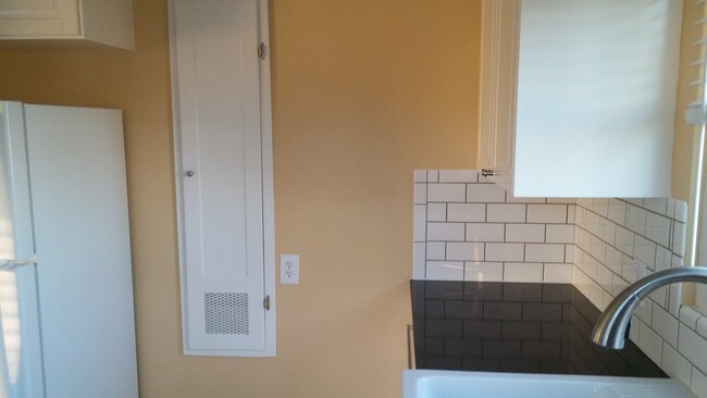 Refrigerator and spice cabinet - 1744 Sunset Cliffs Blvd Apartment Unit 1744