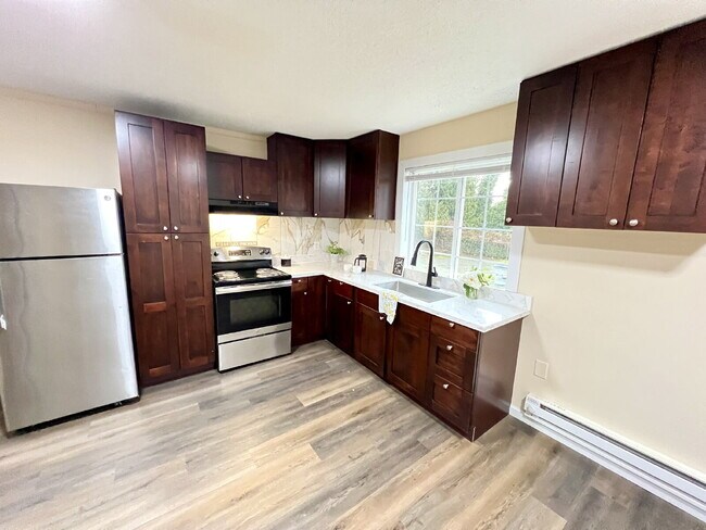 Photo - Elevated 3-Bedroom Home with Secure Garage & Cozy Living Space Unidad C