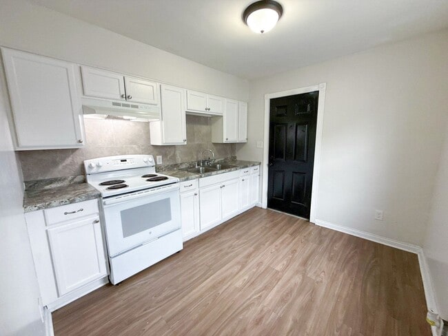 Photo - Move-In Ready 2BR Home w/ Refinished Hardwood Floors + Bonus Room Basement!