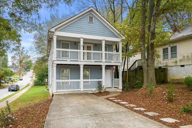 Charming exterior of the home with a welcoming entrance and well-maintained curb appeal - 247 Farrington Ave SE House