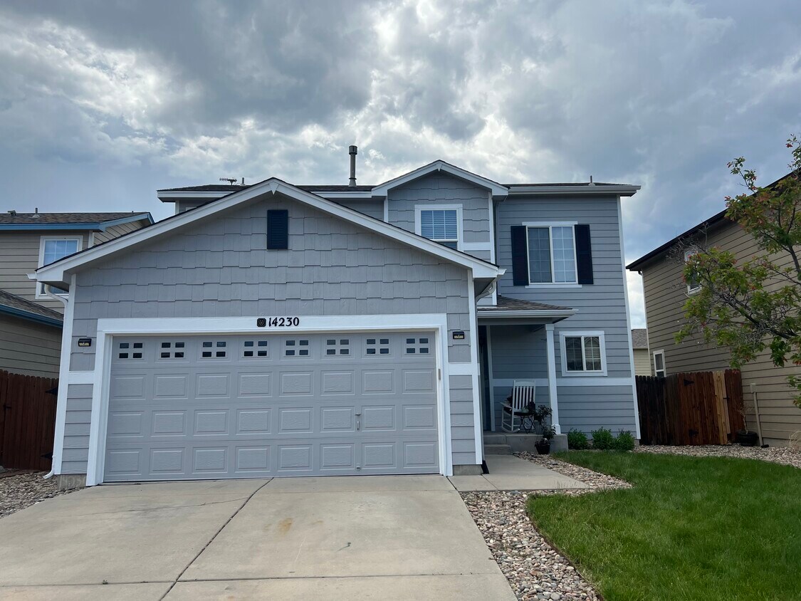 Freshly painted exterior with well-kept landscaping and fenced back yard. Sprinkler system included. - 14230 Woodrock Path (Colorado Springs, CO)