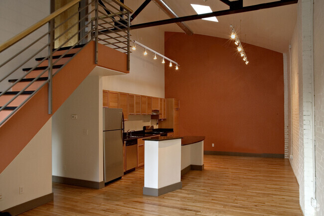 Soaring 22-foot-high loft ceilings. Maple flooring. - 511 W 4th St Unit 1 Rental