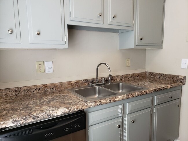 Kitchen with stainless steel dishwasher