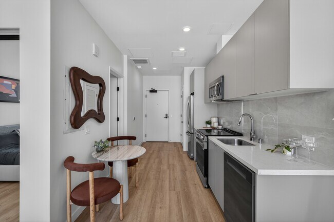 Engineered vinyl wood plank flooring in kitchen & living areas