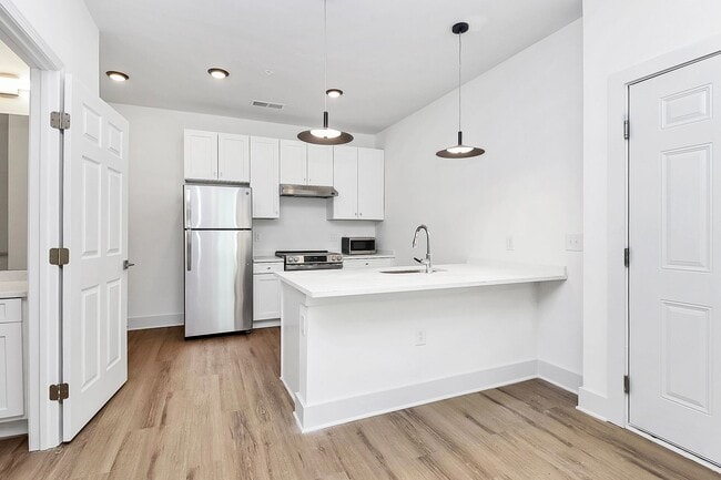 Building Photo - Beautiful Brand New ADA Accessible One Bedroom Apartment!