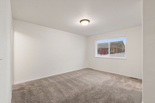 Photo - Students Welcome! Charming 3-Bedroom Home in Greeley with Fenced Yard & Unfinished Basement