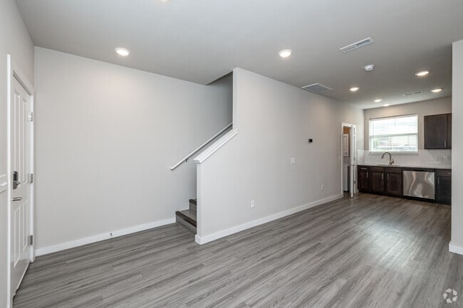 1BR, 1BA - 740SF - Living Room - Thrive Fayetteville
